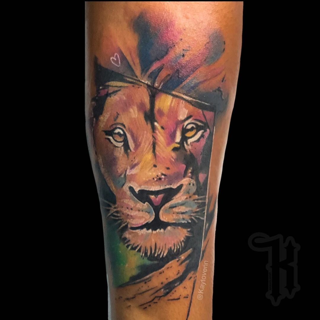 Lion King as color tattoos on dark skin