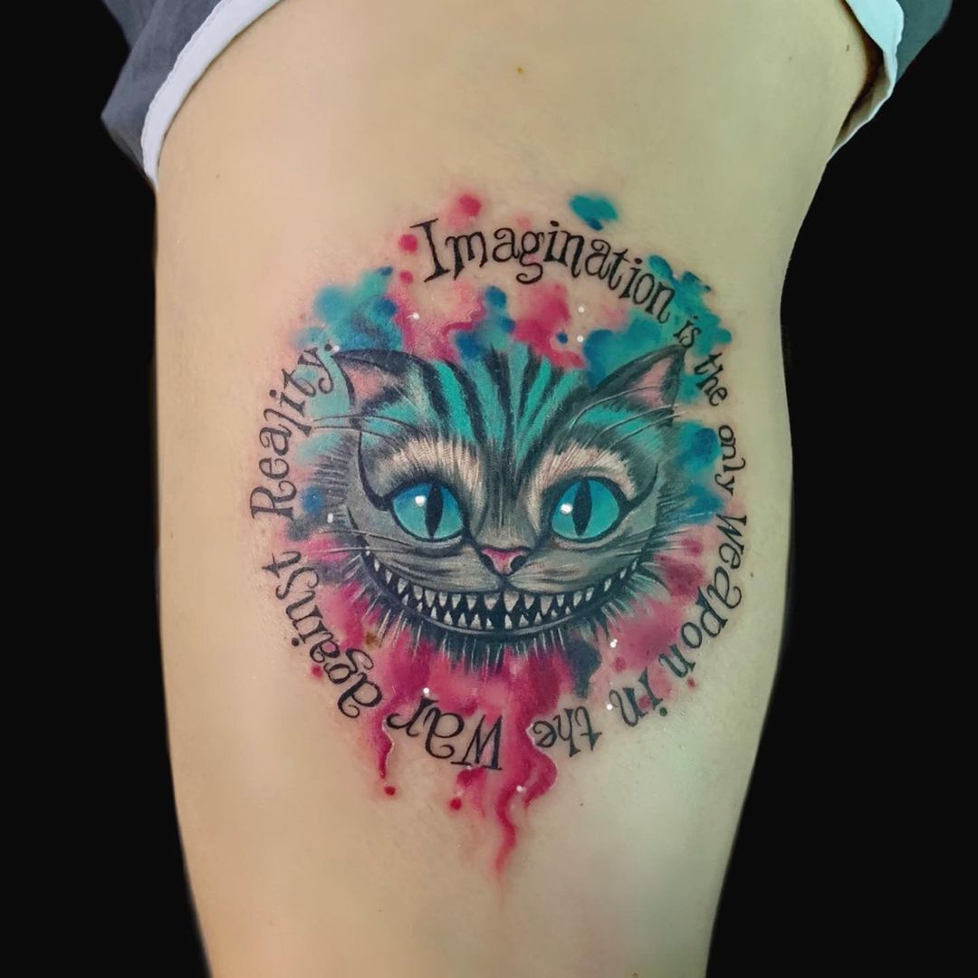Imaginative Cheshire cat tattoo
