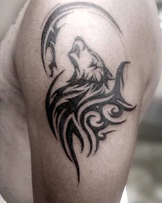 Shining tribal wolf tattoo