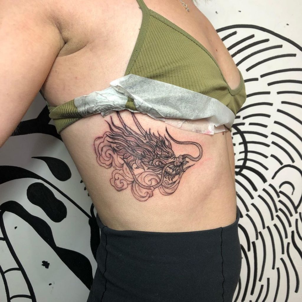 Mythological side tattoos