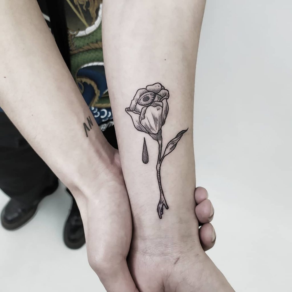 Rose tattoo on an arm