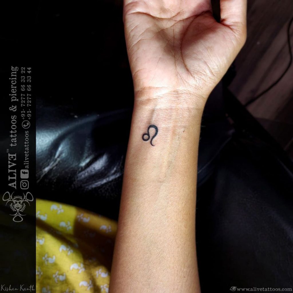 Tiny zodiac tattoo on a wrist