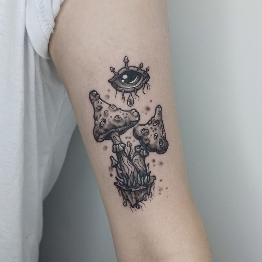 Realistic eye body art on an arm