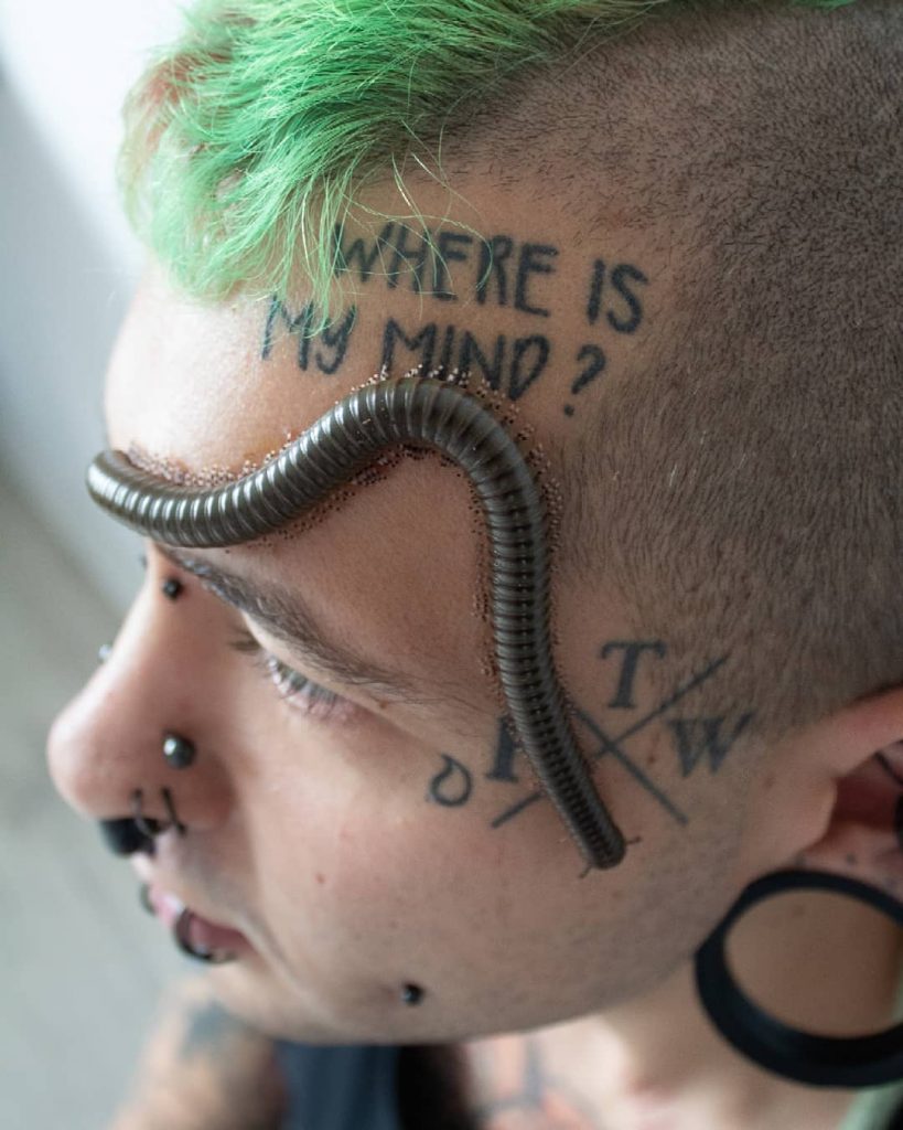 Face tattoos with writing