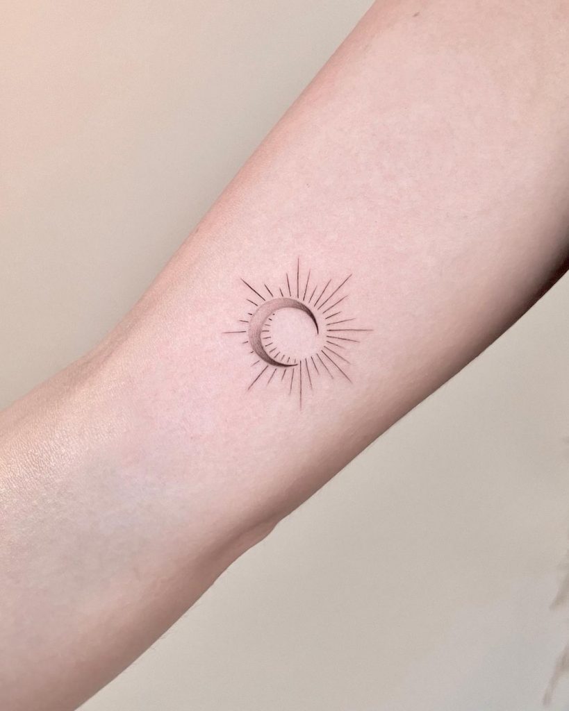 Minimalist sun and moon tattoo