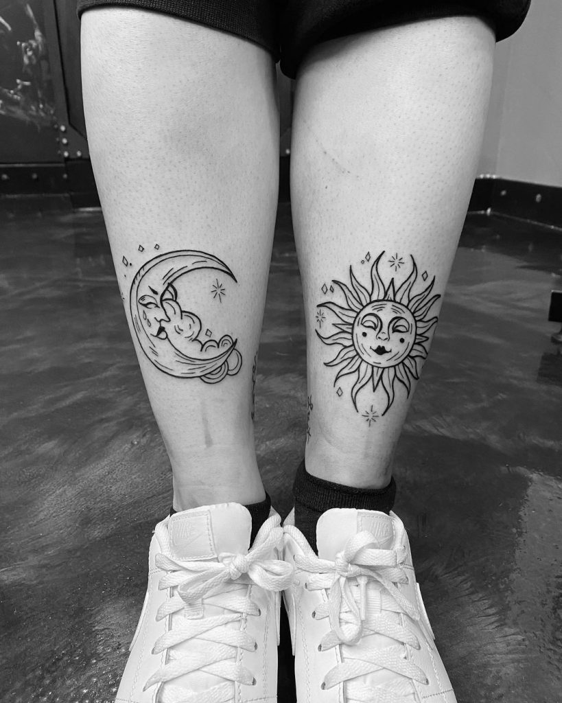 Sun and moon tattoo on legs