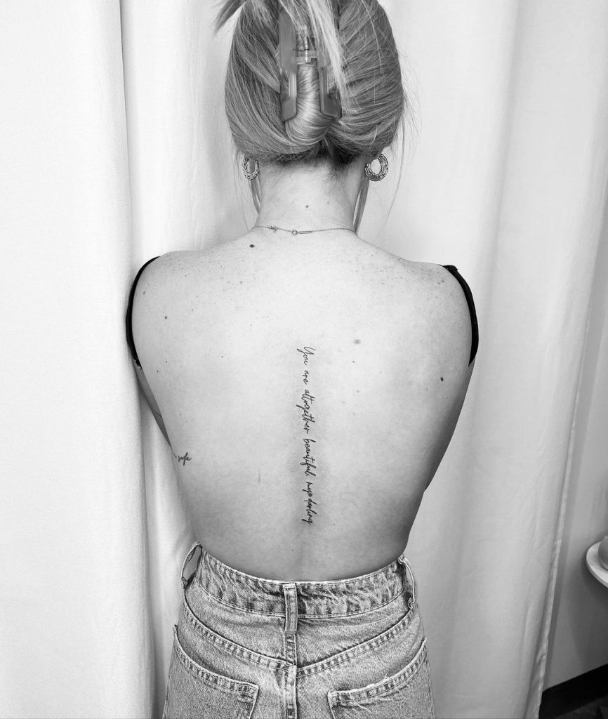 spine tattoos with writing