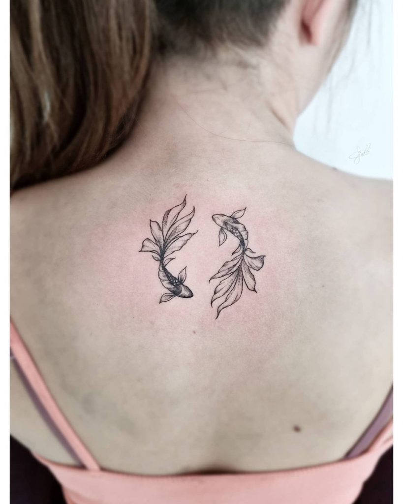 Fishy back tattoos for women