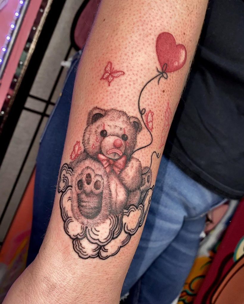 sad teddy bear tattoo