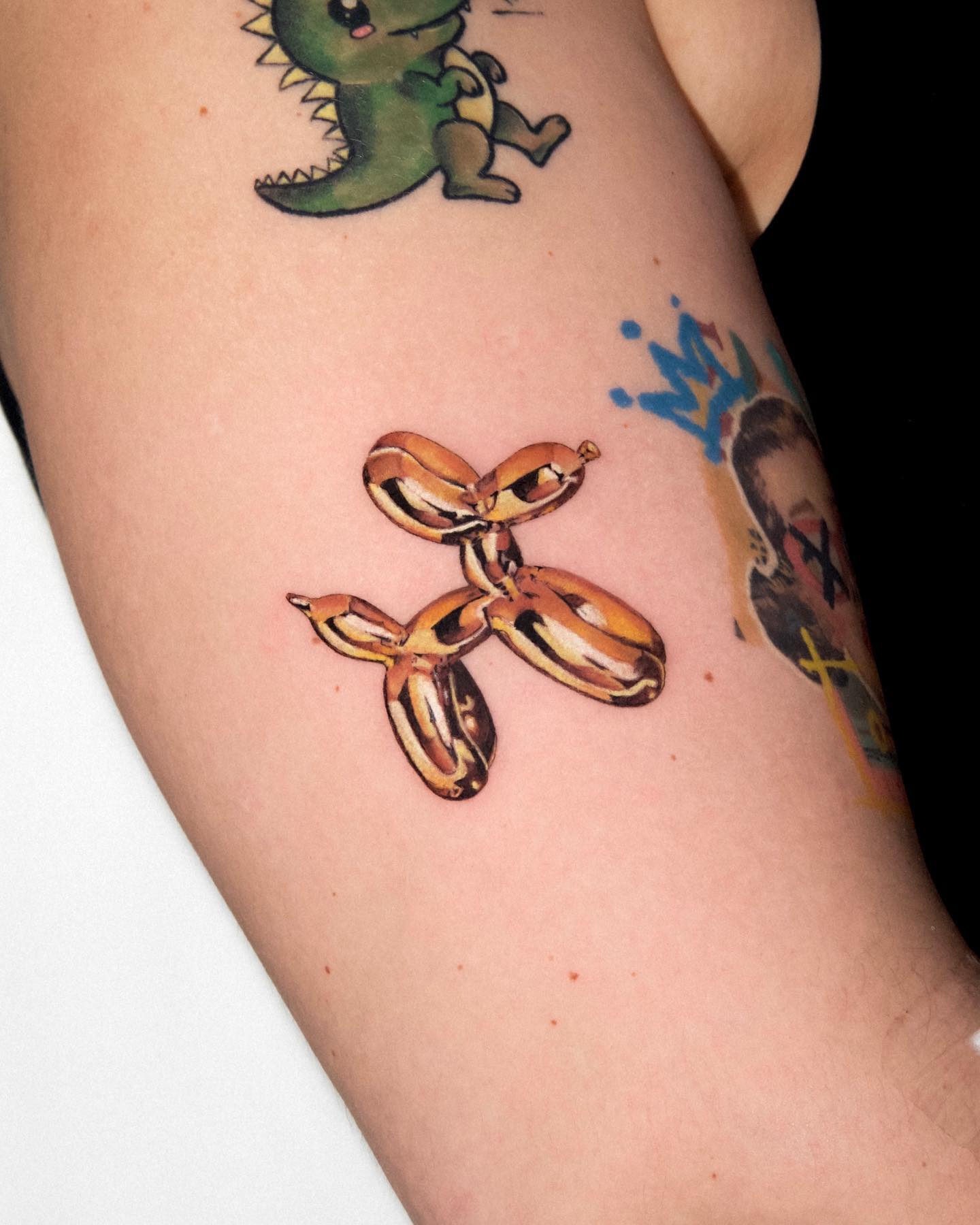 Gold Balloon Dog Tattoo